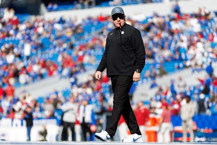 Kentucky Wildcats head coach Mark Stoops walks across the field before the game against the Alabama Crimson Tide at Kroger Field.
